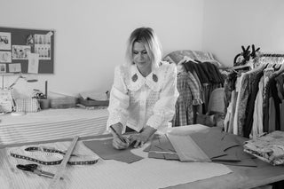 women at pattern table in fashion studio