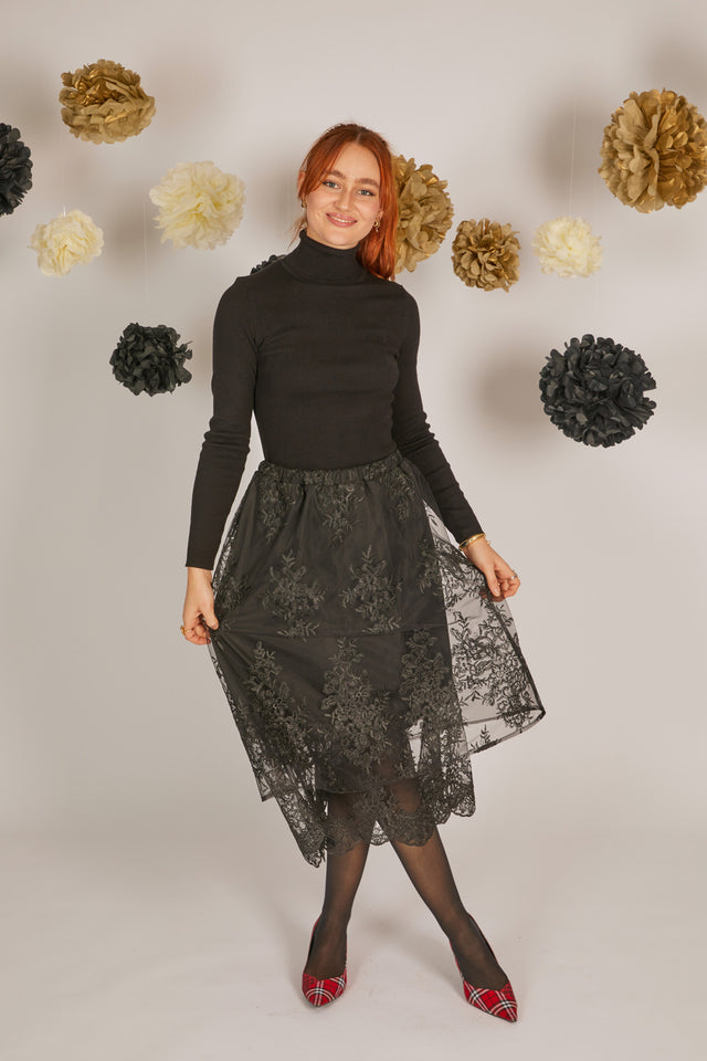 women wearing black lace skirt with layers