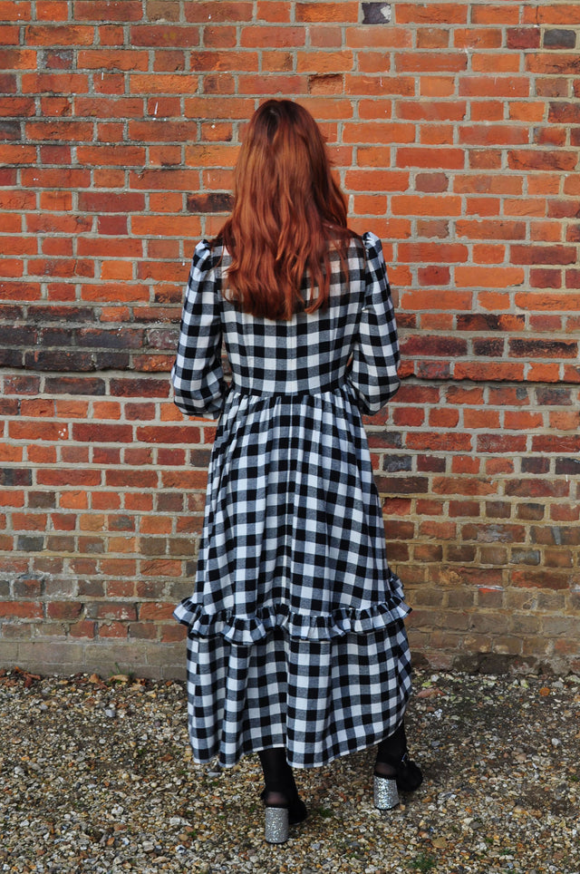 women wearing black and winter white check back