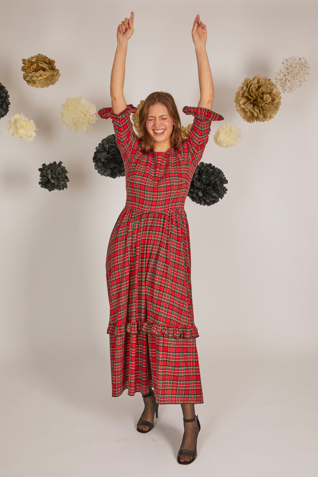women wearing red check dress