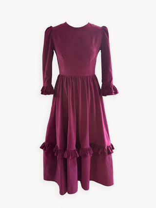 Burgundy dress with puffed sleeves on a white background
