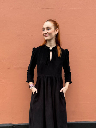 women in black dress detail