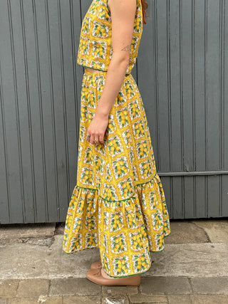 women wearing lemon print skirt side view