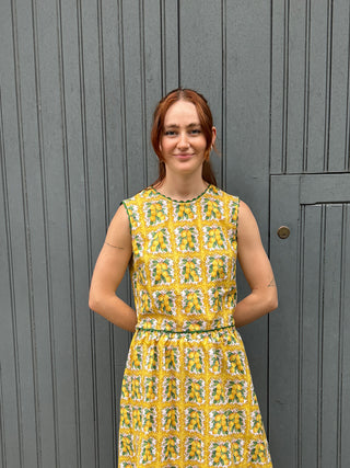 women stood wearing lemon print top