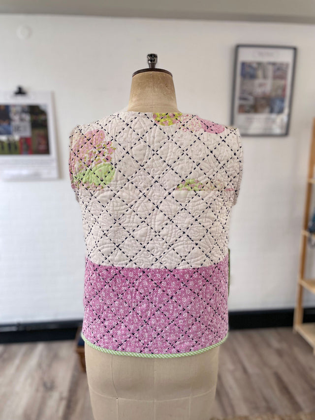 The Well Worn quilted waistcoat mannequin back