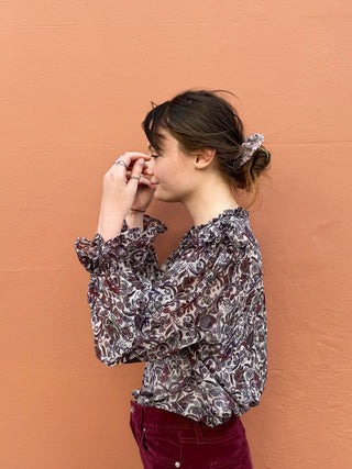 women wearing paisley boho blouse side view
