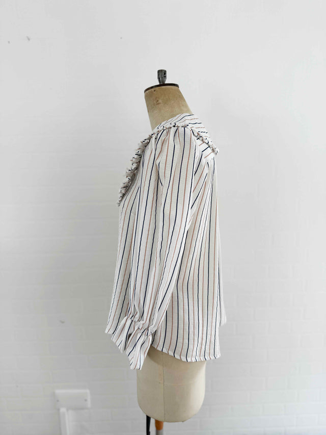 The Well Worn stripe blouse on mannequin side view