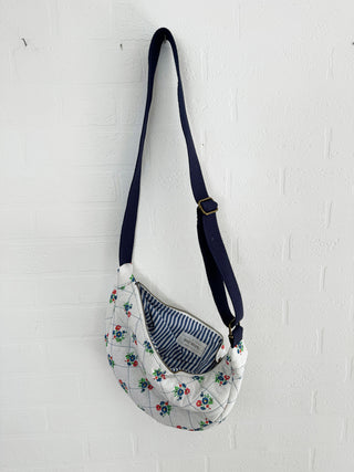 vintage fabric cross body bag hanging on wall