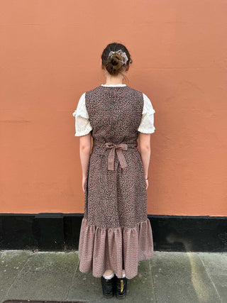 women wearing checked waistcoat with bow