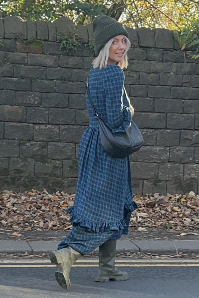 women wearin check dress