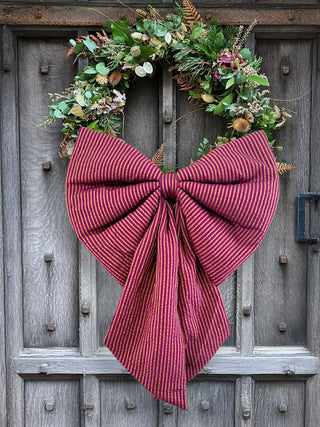 oversized bow on wreath on door