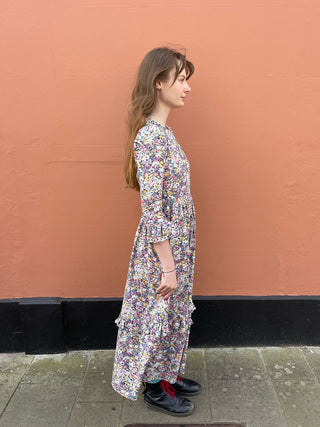 women wearing floral print midi dress side view
