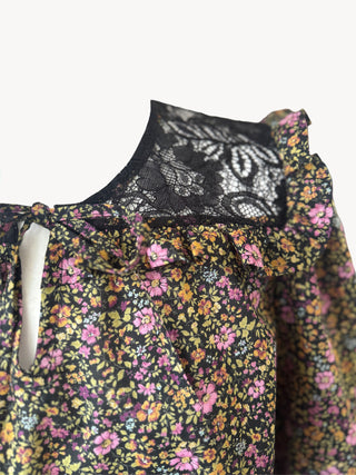 Floral dress with lace trim on a white background