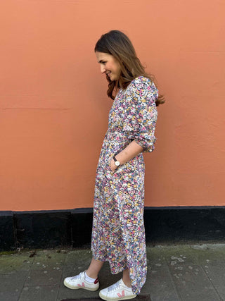 Side view of The Maisie Dress showing easy A-line shape and flowing movement.