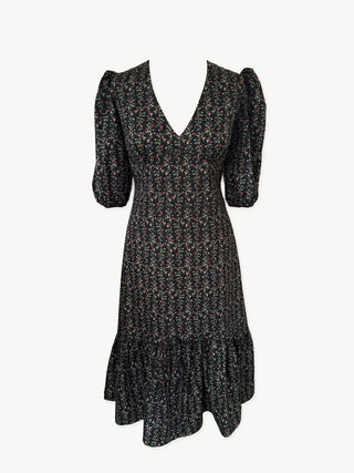 Black floral dress with puff sleeves on a white background