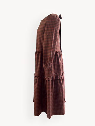 Brown checkered dress on a white background
