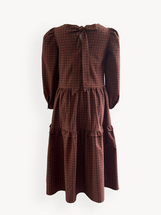 Brown checkered dress with puff sleeves on a white background