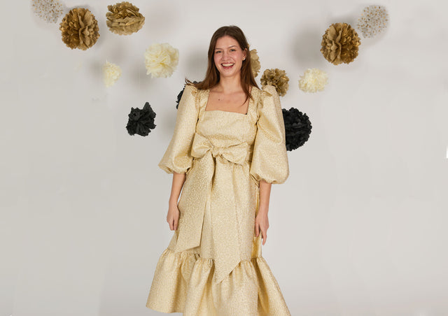 women wearing gold dress