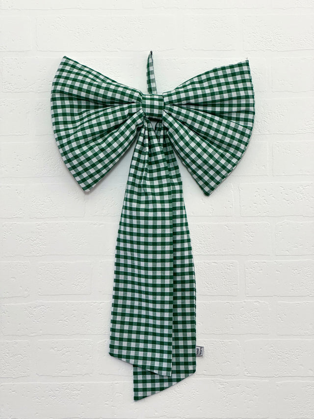 The Well Worn green gingham bow on wall