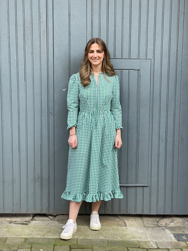 The Well Worn woman wearing gingham dress