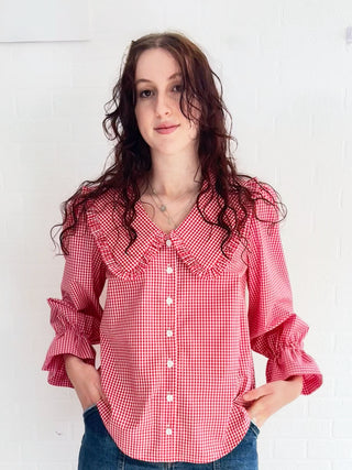 Model wearing Luna Red Gingham Blouse made from deadstock cotton fabric