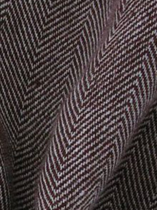 Close-up of a fabric with a zigzag pattern in black and white.