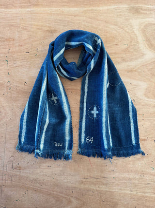 Blue patterned scarf on a wooden surface
