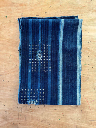Blue patterned fabric on a wooden surface