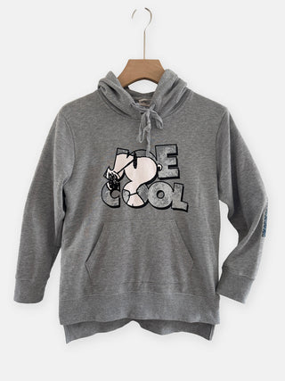 grey snoopy sweatshirt hanging on wall