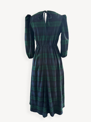 Green plaid dress on a white background