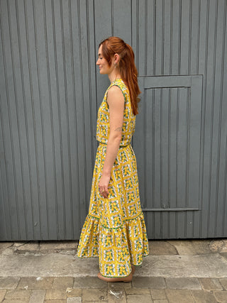 women wearing lemon print top side view
