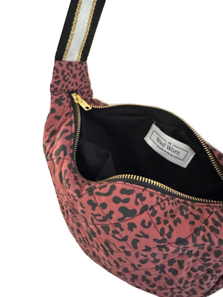 Pink leopard print bag with gold zipper and 'Well Worn' label on a white background