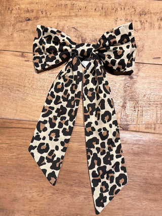 Leopard print bow on a wooden surface