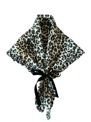 Leopard print headscarf with a black ribbon on a white background