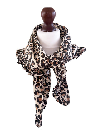 Leopard print scarf on a mannequin with a white background