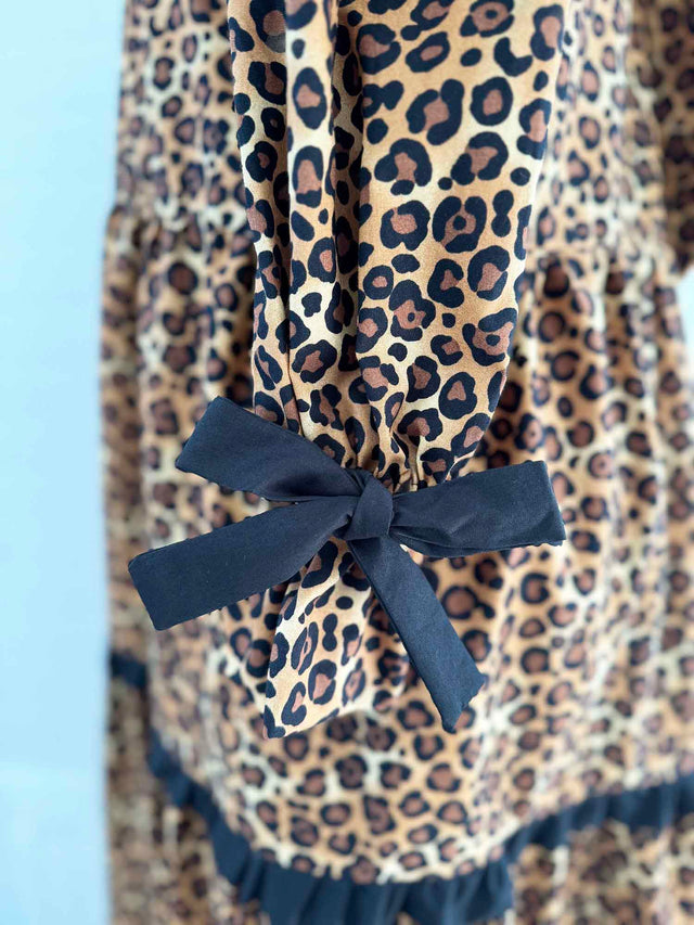The Well Worn leopard dress on mannequin cuff detail