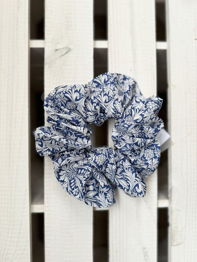 The Well Worn blue liberty fabric scrunchie on white background