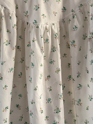 The Lucy Liberty x Bridgerton print top with delicate floral details, ruffled yoke, and sleeves, offering a relaxed, feminine fit for everyday wear.