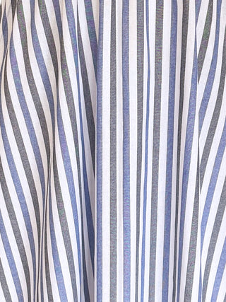 The Ottillie Striped Cotton Dress in blue and white stripes with a V-neckline, balloon sleeves, and side pockets.