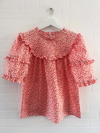 vintage fabric floral blouse on white wall
