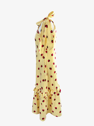 Side profile showing bow-tied straps on The Mila Dress – sustainable UK-made midi dress with ruffle hem and vintage charm