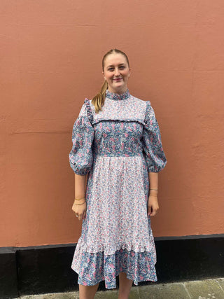 women wearing mixed print floral dress