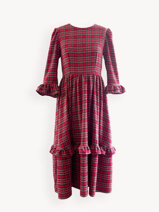 Red and green plaid dress with puffed sleeves on a white background