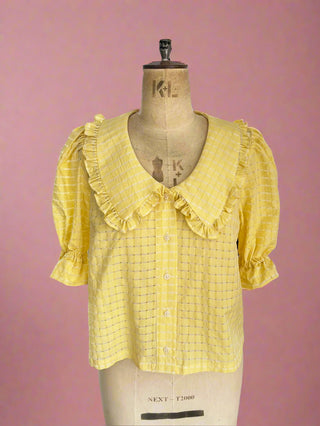 UK-made sustainable collar blouse on a mannequin in the studio, highlighting the design and ethical craftsmanship.