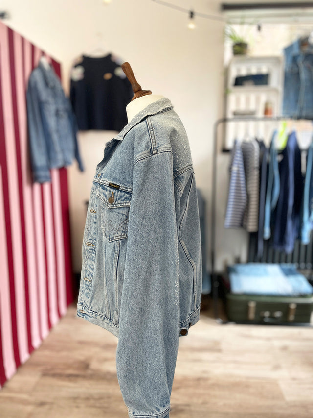 The Well Worn mended denim jacket on mannequin side
