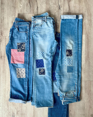 mended and patched denim on floor