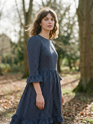 women wearing navy spot dress in countryside