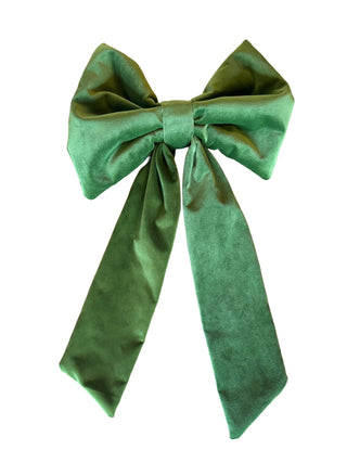 Green velvet bow on a white background