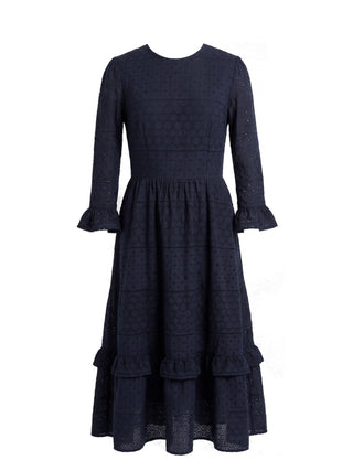 Navy blue dress with ruffled layers on a white background