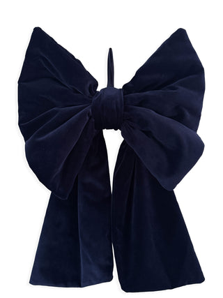 Navy blue velvet bow headband on a white background